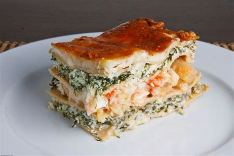 The lasagna is layered with the sauce, a cheesy ricotta filling, shrimp, scallops, calamari, and more cheese. Seafood Lasagna | Recipe | Seafood lasagna recipes ...
