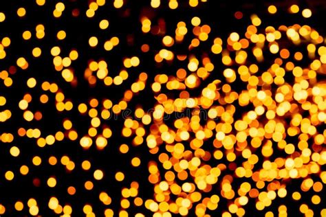 Unfocused Abstract Gold Bokeh On Black Background Defocused And