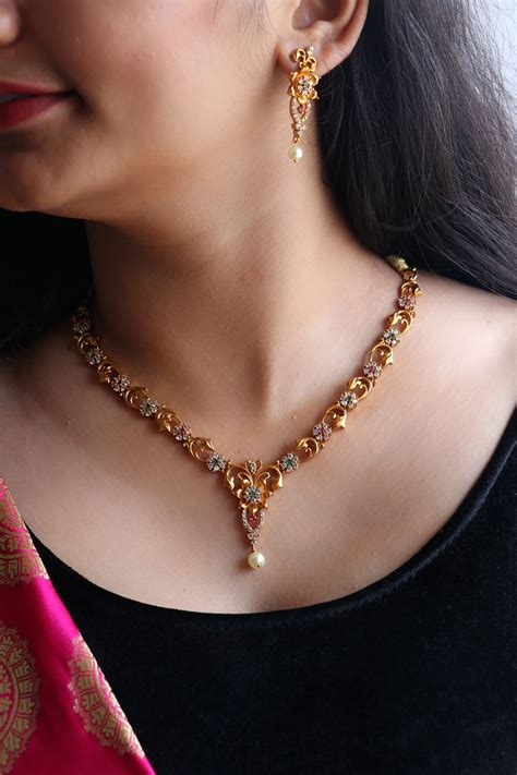See more ideas about gold jewelry simple, gold jewelry, jewelry. Simple AD Floral Gold Finish Short Necklace - South India Jewels