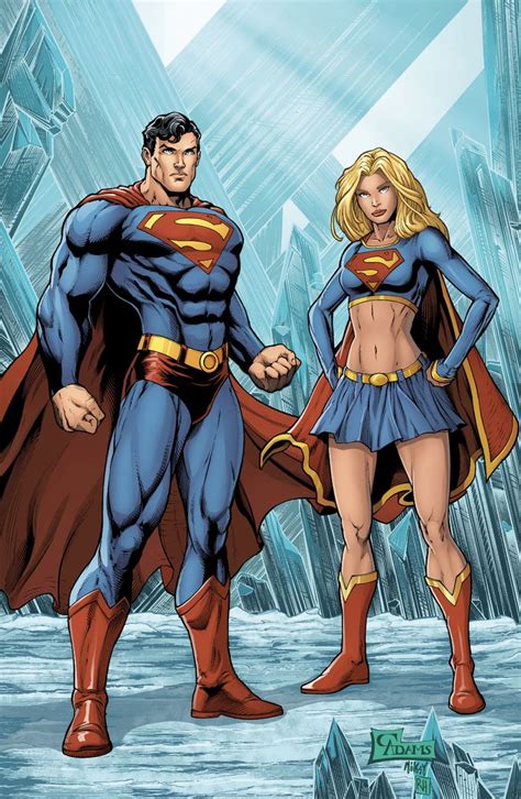 Superman And Supergirl Standing Next To Each Other