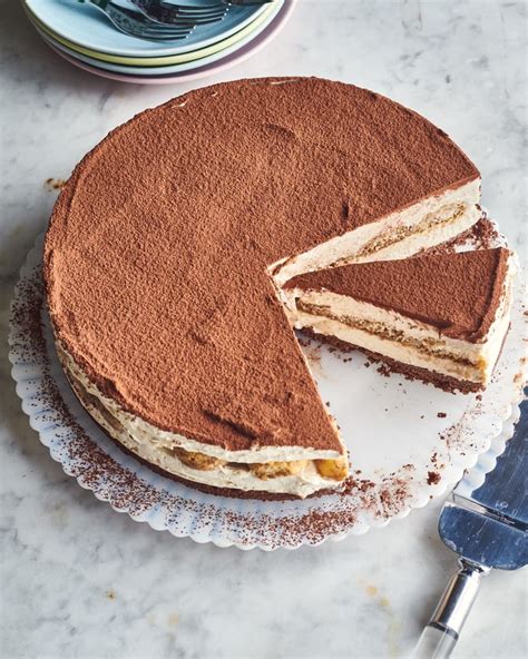 Tiramisu Cheesecake With A Slice Missing On A Cake Plate Tiramisu Cheesecake Creamy Cheesecake