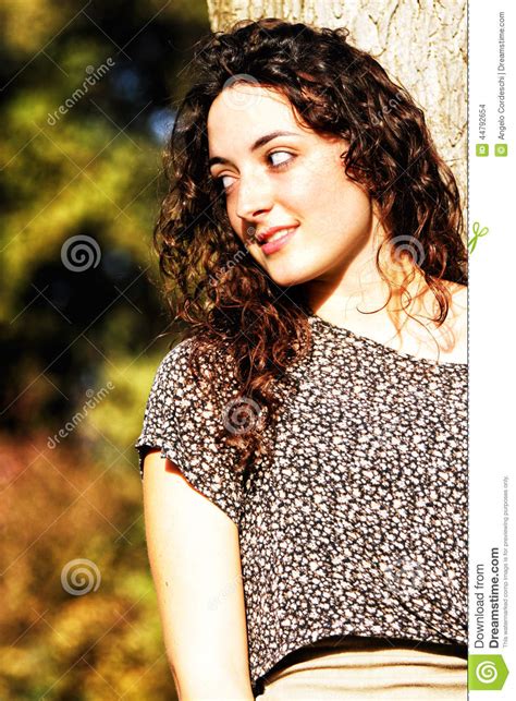 Curly Beautiful Young Girl With Nice Smile Stock Photo