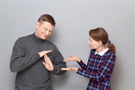 Woman Is Trying To Explain Something Man Is Showing Stop Gesture Stock