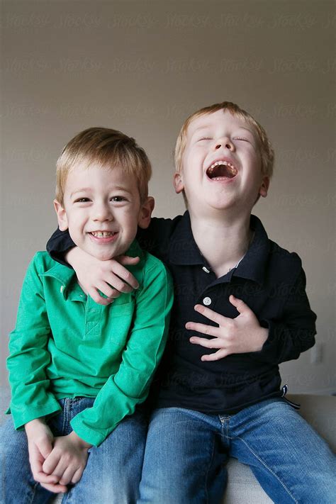 Two Young Boys Laughing By Stocksy Contributor Meghan Boyer Stocksy