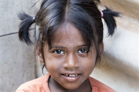Portrait Of Unidentified Indian Poor Kid Girl Child Is Smiling Outddor