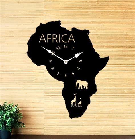 A Wall Clock With The Shape Of Africa On It