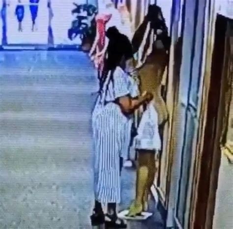 slay queen caught on cctv camera stealing dress outside a boutique in lagos