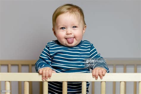 Baby In The Crib High Res Stock Photo Getty Images