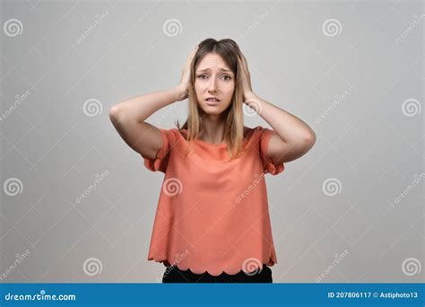 Portrait Of Concerned Worried And Anxious Blond Girl Grab Head And