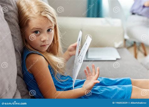 Adorable Caucasian Child Girl Hold Drawing Of Parents Separated Stock