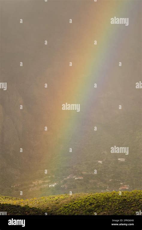 Rainbow Over A Hill Of The Tirajana Crater Stock Photo Alamy