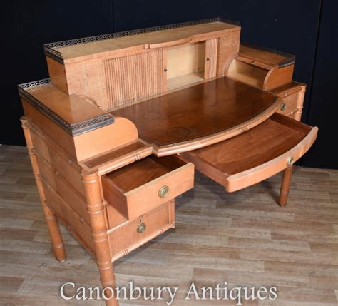 Distressed old desk holds books, rolled parchments and and inkwell with feather pen, and the matching chair contains an animated sit pose. Regency Bamboo Desk and Chair Set Writing Table