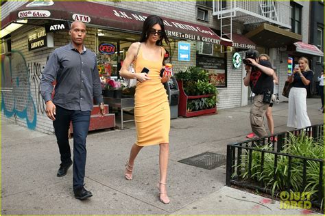 Photo Kendall Jenner Rocks Orange Dress While Buying Orange Coke