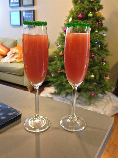 Have a merry christmas ! Cranberry and orange mimosas. Rim your champagne glasses ...