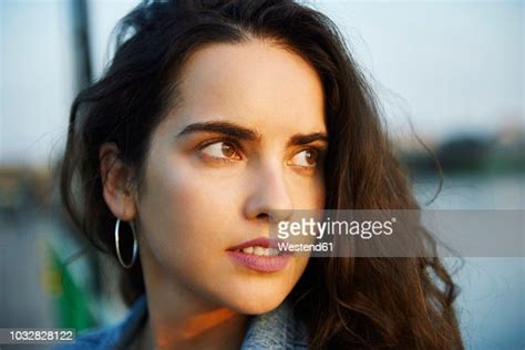 Beautiful Young Woman Looking Back High Res Stock Photo Getty Images