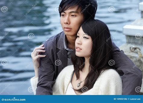 Young Chinese Lovers Embracing By River Stock Photo Image Of Romance