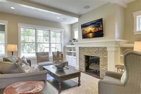 This streamlined fireplace is the perfect fit for the modern, thoughtfully curated, and layered living room. craftsman style fireplace living room with home builders