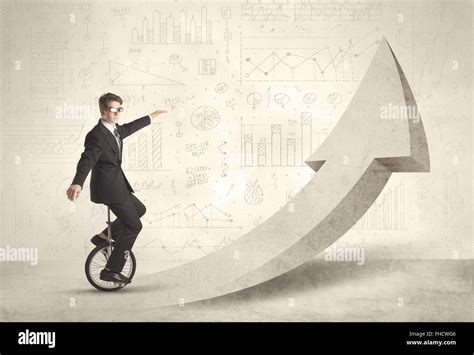 Happy Business Man Riding A Monocycle Up On An Arrow Stock Photo Alamy