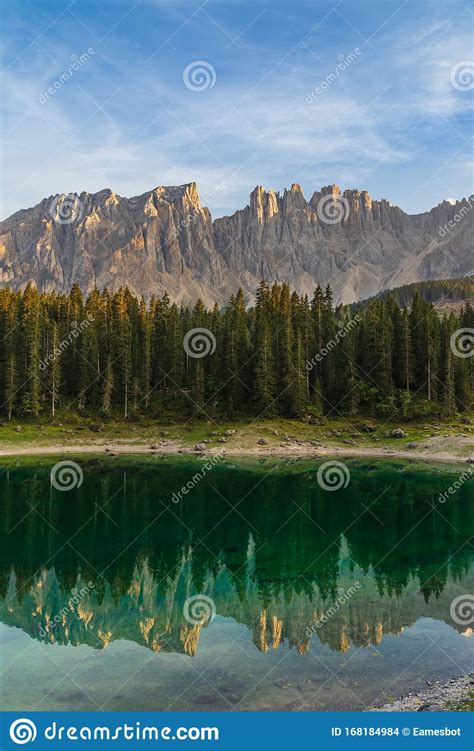 Beautiful Turquoise Green Water In Carezza Lake With Reflection Of