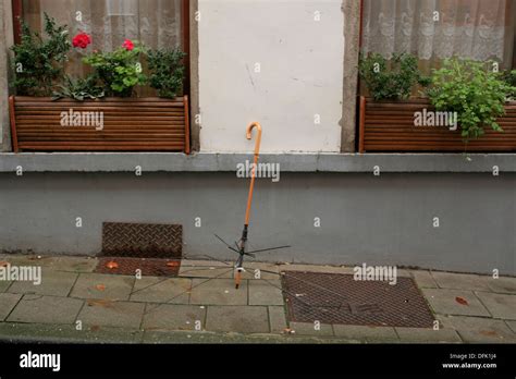 Broken Umbrella On A Street Stock Photo Alamy