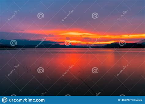 Red And Orange Sunset Sky At The Mountain And Lake Beautiful Evening