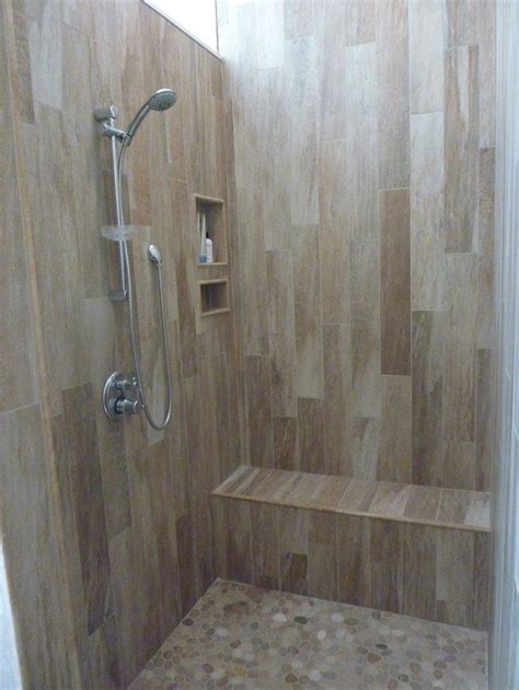 How to tile a bathroom wall video. Revamp your bathroom with a pebble shower floor | DIY ...