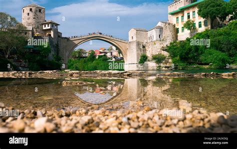 Old Bridge And Its Reflection In River Neretva Mostar Bosnia And