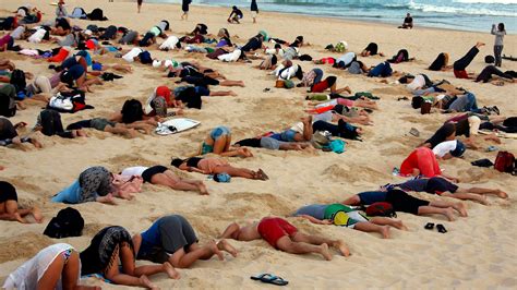 400 People Bury Their Heads In The Sand To Protest