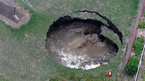Watch Sinkhole Open Up In Australian Backyard