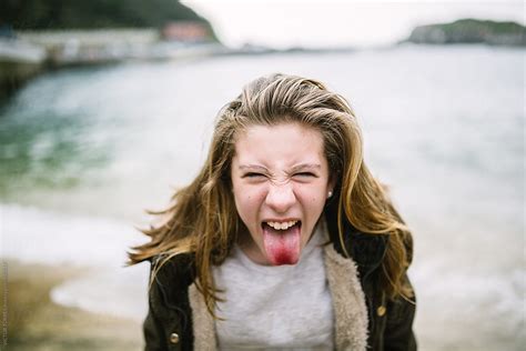 Teenager Sticking Out Tongue By Victor Torres