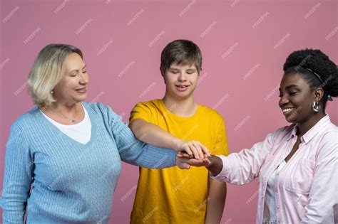Premium Photo Unity Smiling Guy With Down Syndrome Mom And Dark
