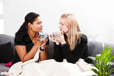 Two Female Friends Drinking Tea Stock Image Colourbox