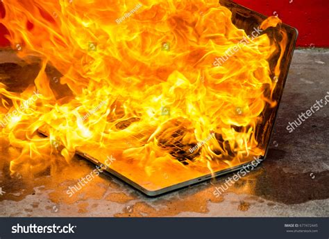 Laptop Computer Exploding Into Flames Burning Stock Photo 677472445
