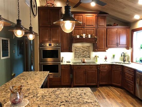The kitchen pictured above is a perfect example featuring a work island, beverage center and breakfast bar. Open Kitchen Design Trends 2019