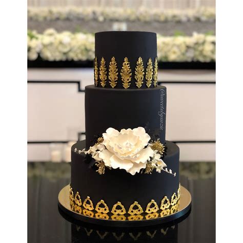 A Wedding Cake With A Combination Of Gold And Black Is A Unique Choice