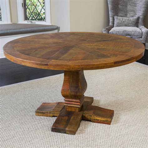 The California Vintage Round Mango Wood Dining Table Is An Elegant
