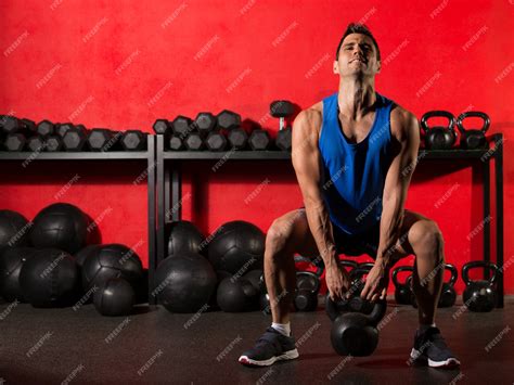 premium photo kettlebell workout training man at gym