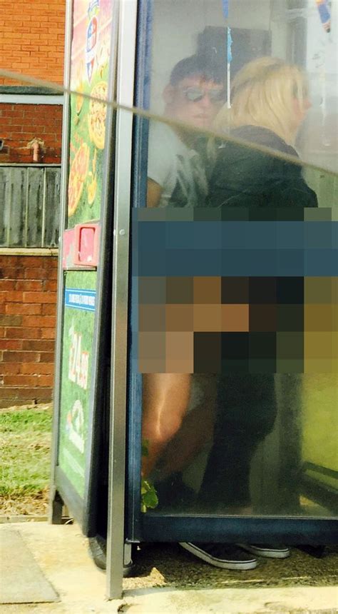 Phone Box Sex Couple Pictured Openly In Passionate Public
