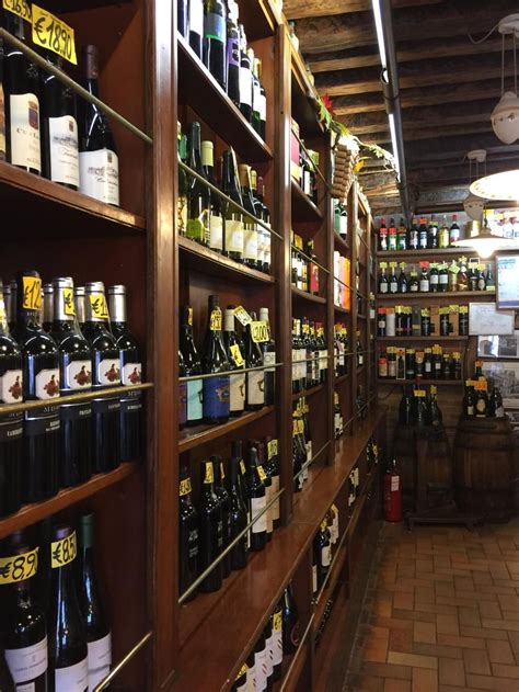 The Shelves Are Filled With Many Different Types Of Wine