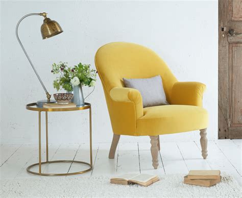 Featuring button tufted backrest for added style and webbed seating for comfort. Munchkin | Comfy Occasional Chair | Loaf