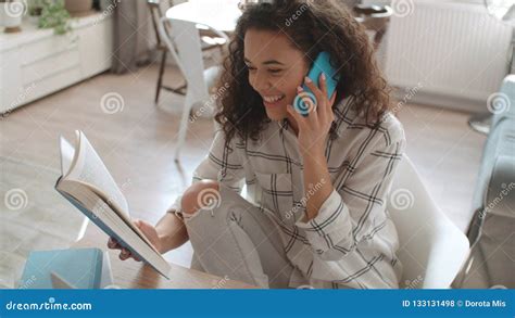 Young Woman Using Mobile Phone At Home Stock Photo Image Of