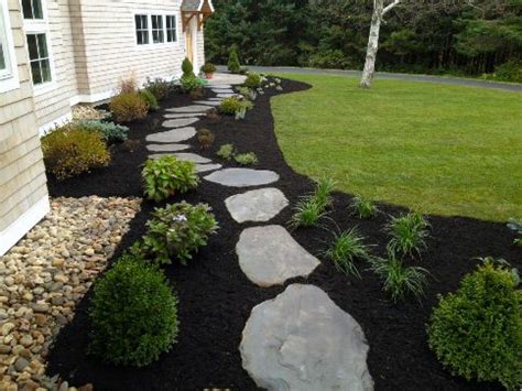 The assortment and arrangement of bricks can easily transform your walkway design idea. Mulch with a Flagstone Path, Beautiful! | Landscaping with ...