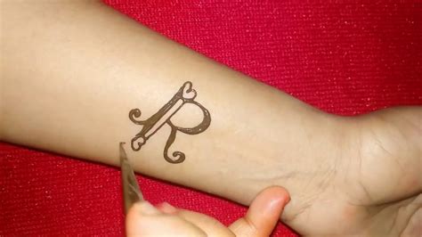 22.you can send a strong message to the world through your tattoo and hand is the best part for it. DIY ''R'' letter henna tattoo - YouTube