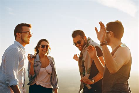 Free Photo Group Of People Having Fun Together Under The Sun Backlit