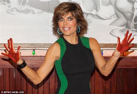 Lisa Rinna Gets Handsy With Pasta Sauce In A Curve Hugging Black Dress