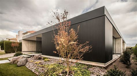 Dark And Dashing Exterior In Black Contemporary Ll House In Argentina