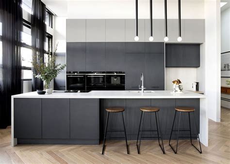 As more homeowners lean toward moodier hues, this rich gray is a solid entry point: 32 Fabulous Grey Kitchen Cabinets You Will Love in 2020 (With images) | The block kitchen, Grey ...