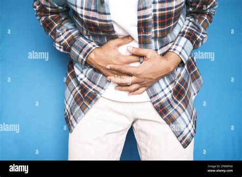 Young Man Suffering Stomach Pain Close Up Stock Photo Alamy