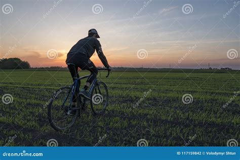 Man Ride A Bicycle In Sunset Riding A Bicycle At Sunset Healthy