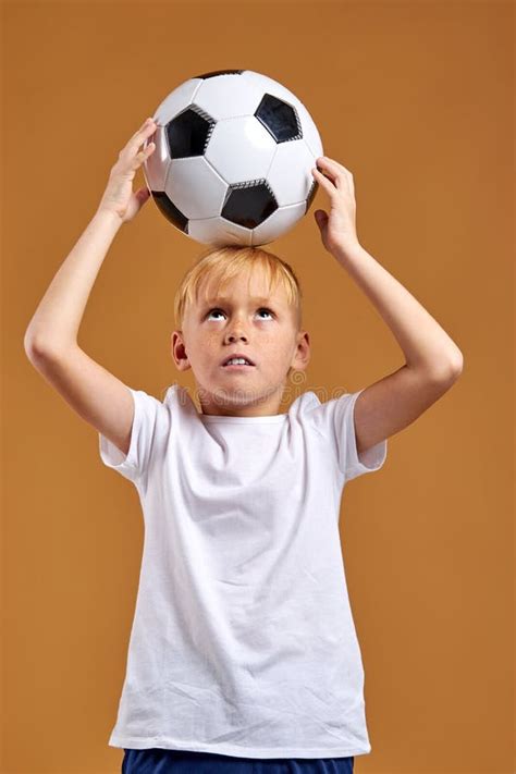 Caucasian Child Boy Holding Soccer Ball Over Head Enjoy Sport